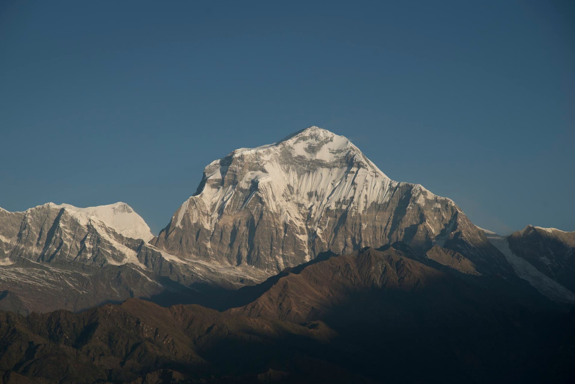 The snow dome of Dhaulagiri I above the ridges of the Myagdi valley