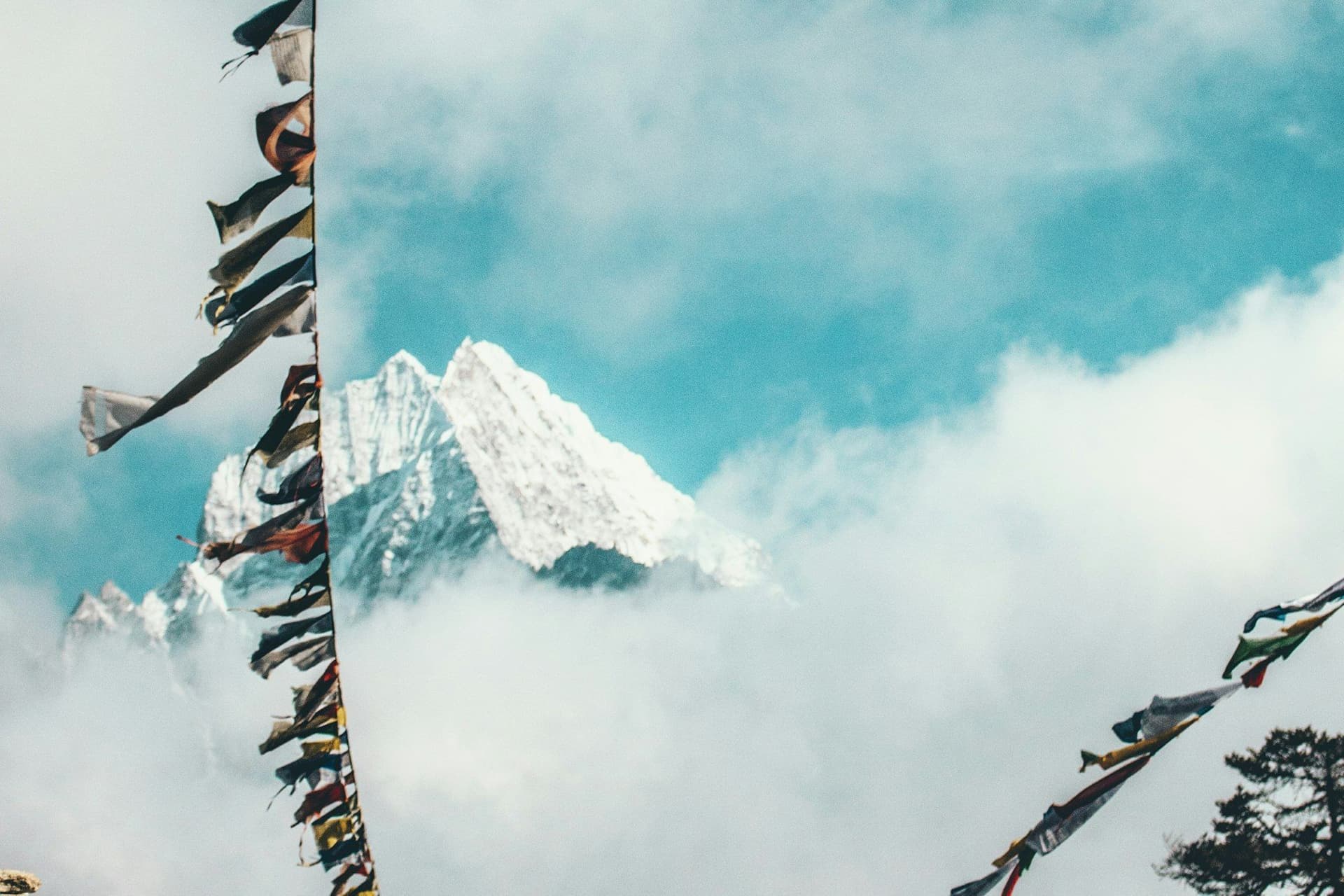 Washing strung on a line below a snow-covered ridge
