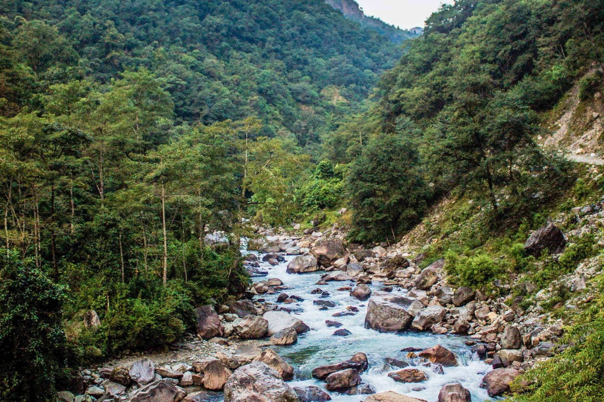 A glacial river running through a boulder-strewn gorge