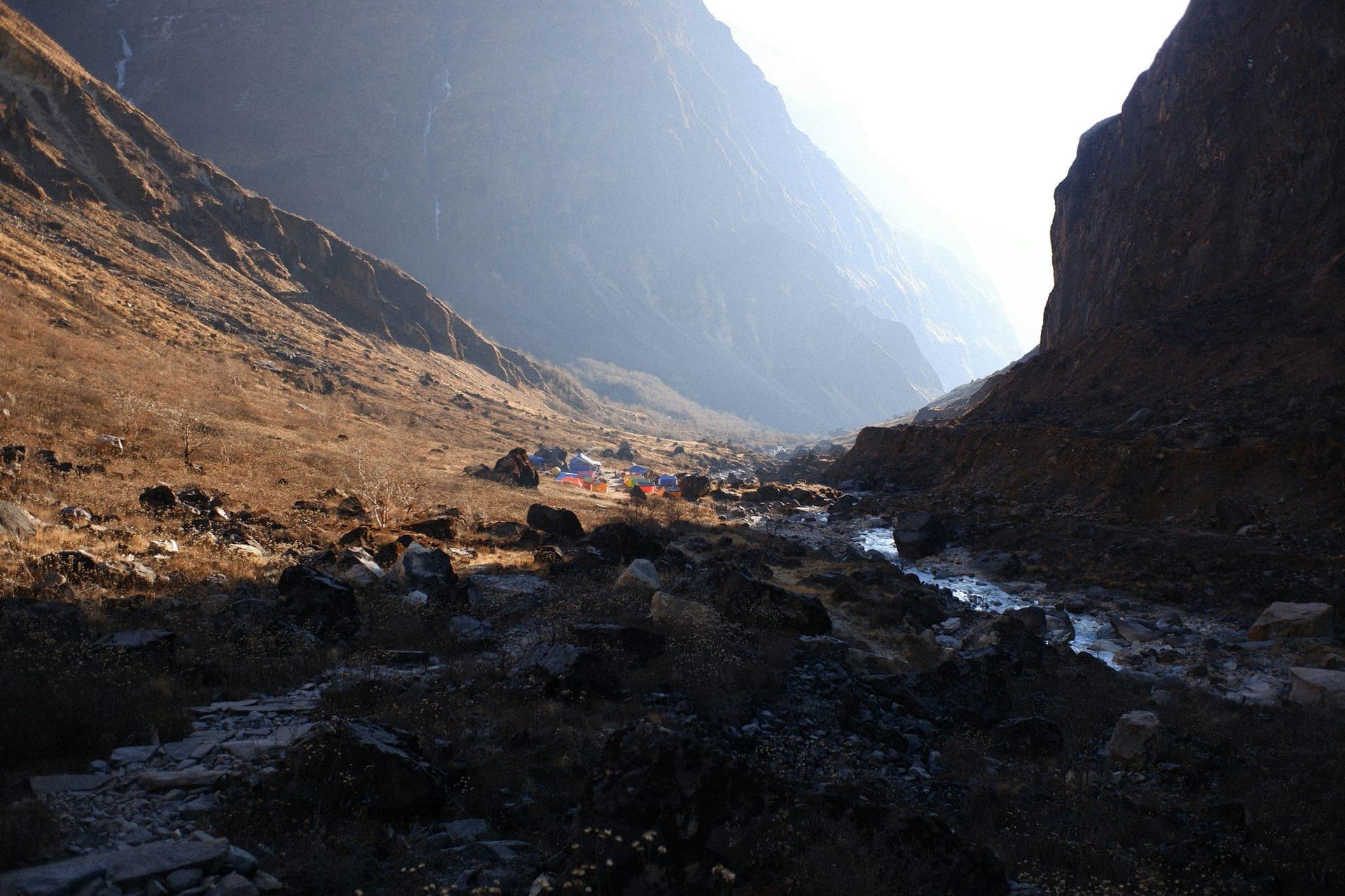 A river running through a steep, empty mountain valley